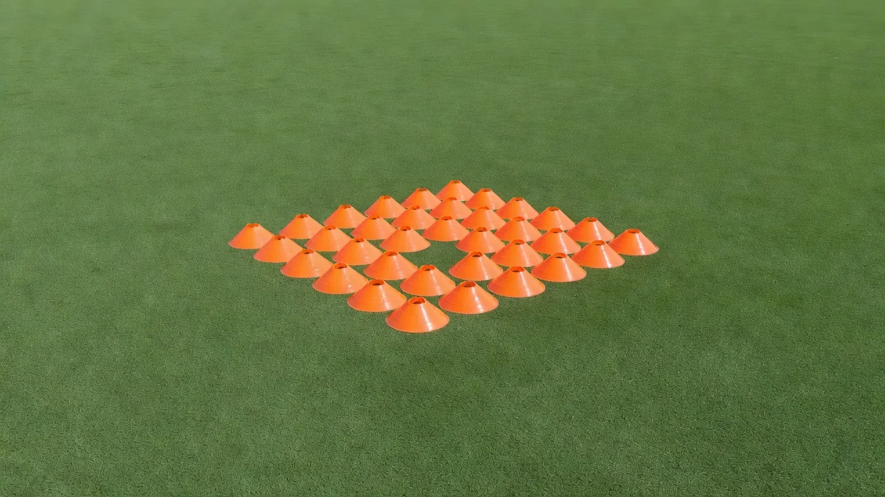 A compact block of orange cones with a single gap left open, aerial view